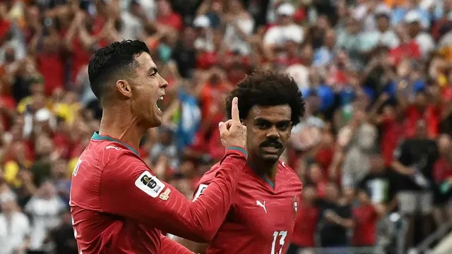 Cristiano Ronaldo melakukan selebrasi setelah mencetak gol di gawang Uzbekistan pada pertandingan yang digelar di Stadion Houston, Houston, Amerika Serikat, Selasa (23/6/2026). (AFP)