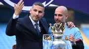 Pep Guardiola bersama pemilik klub, Khaldoon al-Mubarak dalam perayaan gelar Liga Inggris 2022/2023. (AFP)